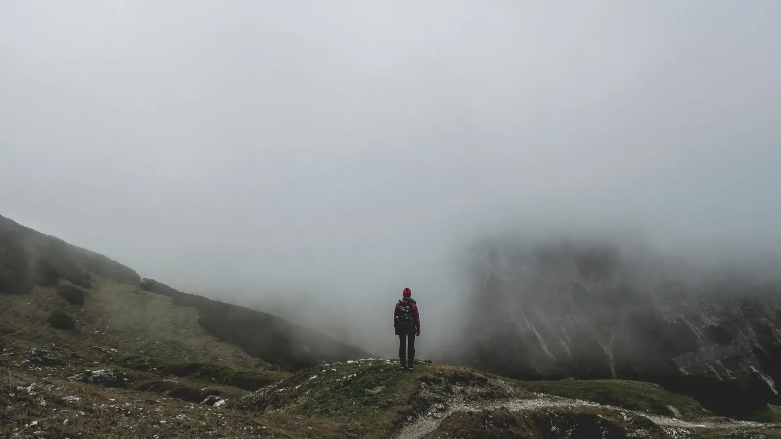 Hiker on a trail — Photo by Paul Gilmore on Unsplash