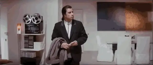 John Travolta looking around, confused, in the Pulp Fiction reaction GIF.